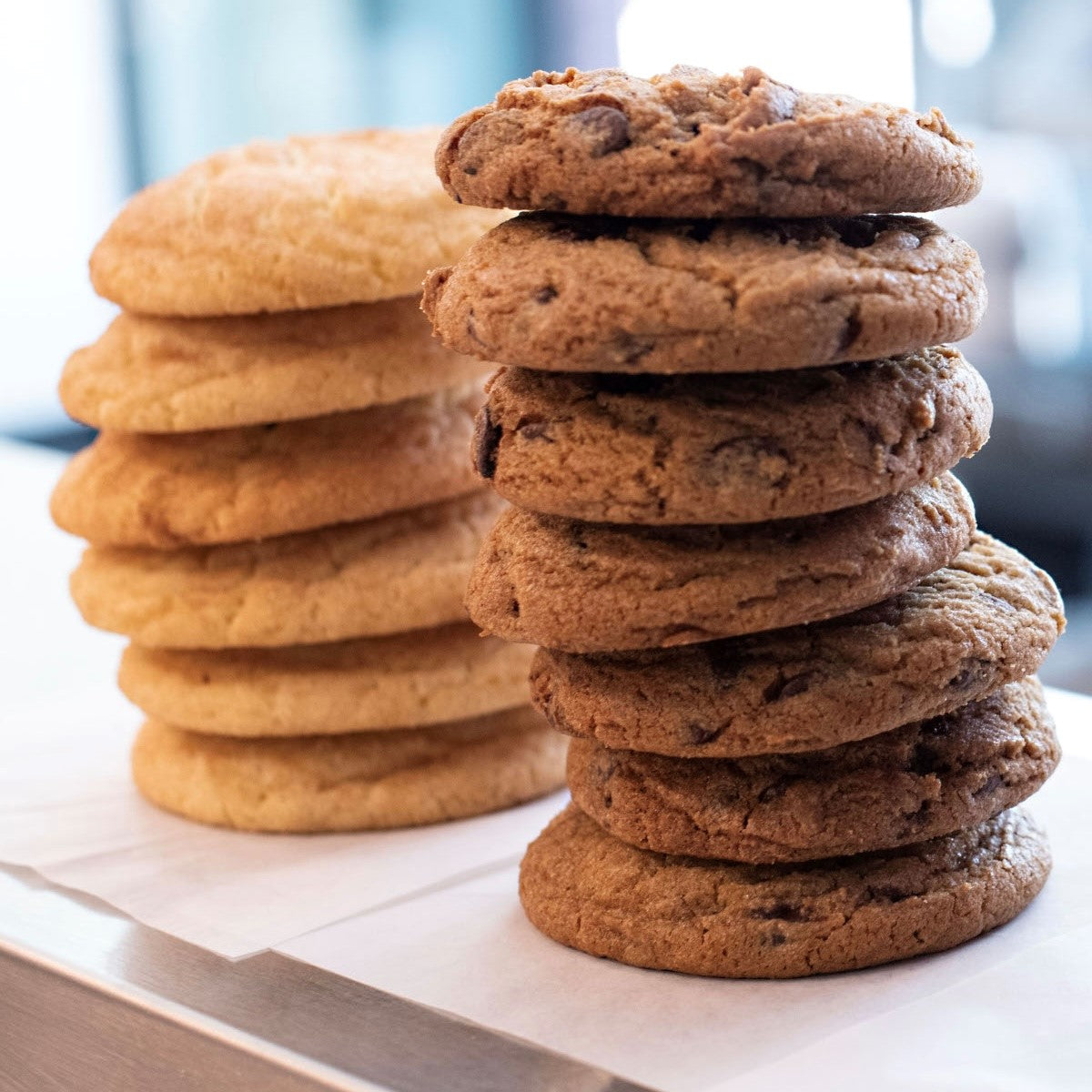 A stack of chocolate chip and snickerdoodle cookies