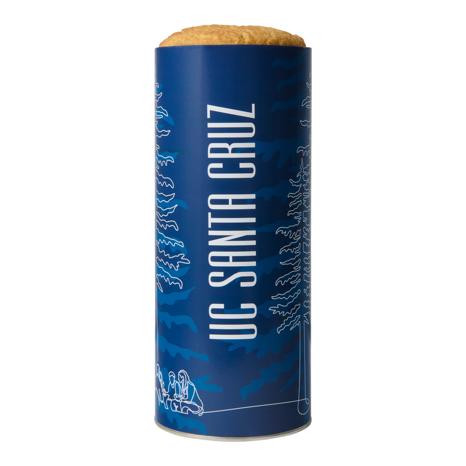 UC Santa Cruz Cookie Gift Tower – tall navy blue gift tin filled with fresh-baked cookies, featuring bold white UC Santa Cruz lettering and line art of redwood trees and students gathered on campus.