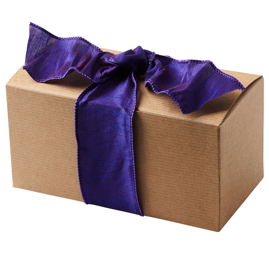 A brown kraft box with a purple bow.